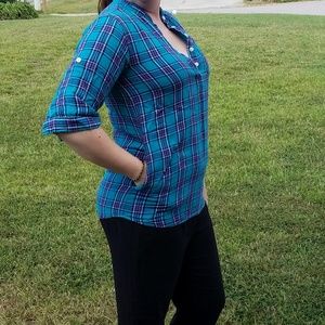 Adorable plaid shirt with pockets at waist!